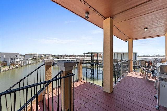 wooden deck with a water view