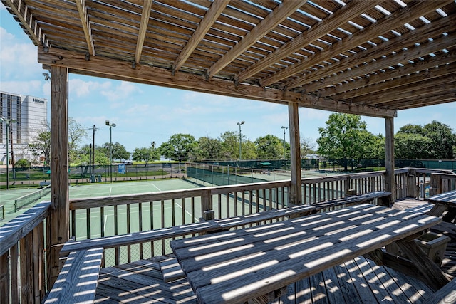 2729 Lighthouse Dr, Houston, TX 77058 - wooden terrace with a tennis court and fence
