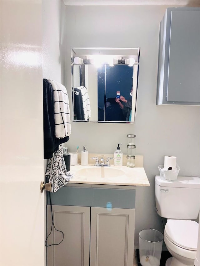 7600 Emmett F Lowry Expy Unit 310, Texas City, TX 77591 - bathroom featuring vanity and toilet