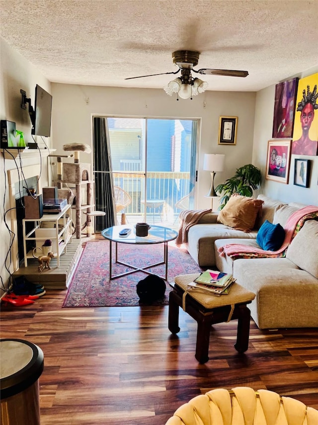 7600 Emmett F Lowry Expy Unit 310, Texas City, TX 77591 - living area with a textured ceiling, a ceiling fan, and wood finished floors