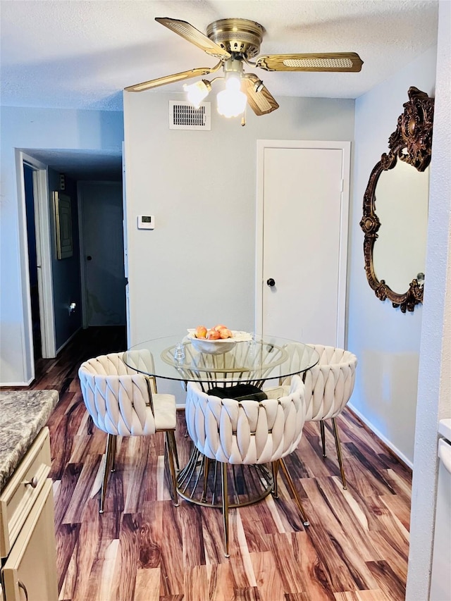 7600 Emmett F Lowry Expy Unit 310, Texas City, TX 77591 - dining area featuring a ceiling fan and wood finished floors