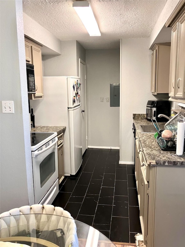 7600 Emmett F Lowry Expy Unit 310, Texas City, TX 77591 - kitchen with white appliances, electric panel, a textured ceiling, a sink, and dark tile patterned flooring