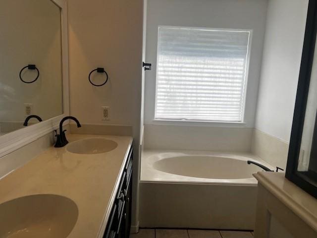 4027 N Fm 565th Rd, Mont Belvieu, TX 77523 - bathroom with a bath, double vanity, and tile patterned flooring
