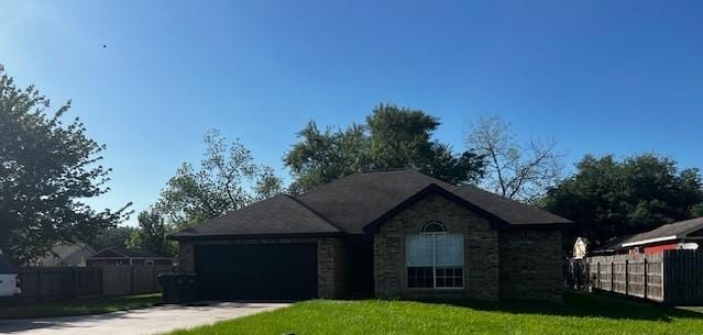 4027 N Fm 565th Rd, Mont Belvieu, TX 77523 - ranch-style house featuring an attached garage, driveway, and stone siding