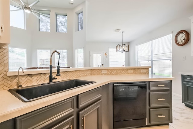 7015 Timber Edge Ln, Humble, TX 77346 - kitchen with dishwasher, a sink, tasteful backsplash, and ceiling fan