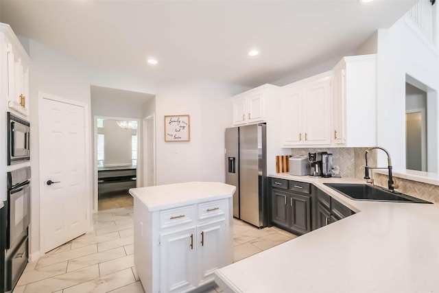 7015 Timber Edge Ln, Humble, TX 77346 - kitchen featuring stainless steel fridge with ice dispenser, a sink, light marble finish flooring, oven, and recessed lighting