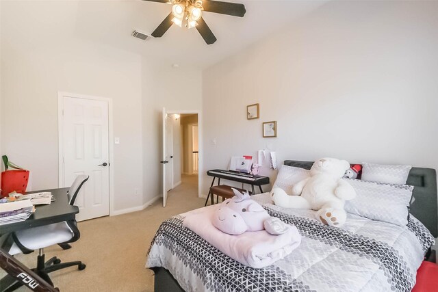 7015 Timber Edge Ln, Humble, TX 77346 - bedroom with light carpet, baseboards, and ceiling fan