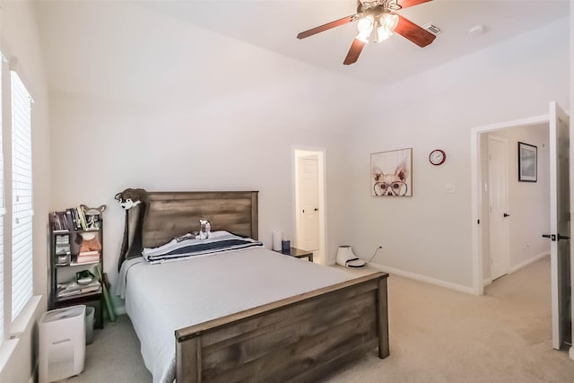 7015 Timber Edge Ln, Humble, TX 77346 - bedroom featuring light carpet, vaulted ceiling, ceiling fan, and baseboards