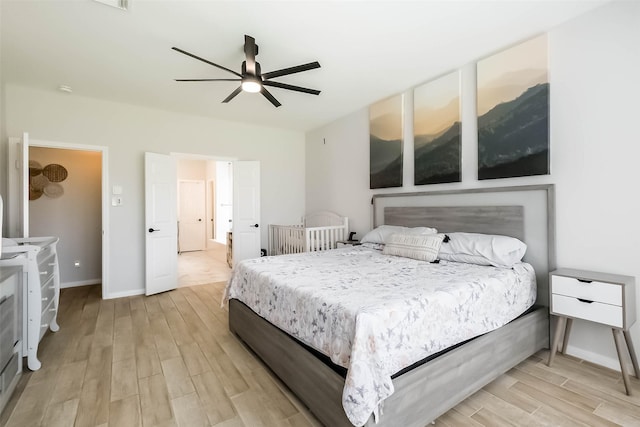 7015 Timber Edge Ln, Humble, TX 77346 - bedroom featuring light wood-type flooring, baseboards, and a ceiling fan