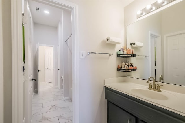 7015 Timber Edge Ln, Humble, TX 77346 - bathroom featuring marble look tile flooring, vanity, and baseboards