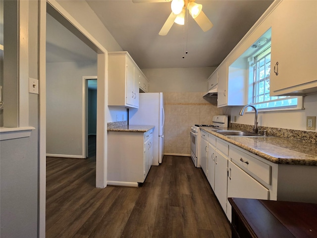 kitchen with white cabinets, ceiling fan, a sink, white appliances, and dark wood-style floors