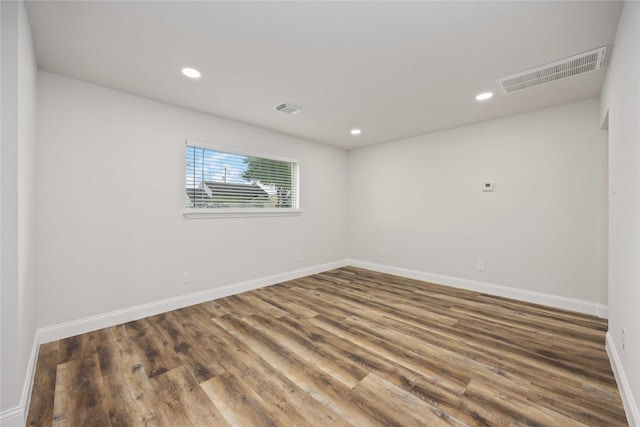 3806 Zephyr St, Houston, TX 77021 - empty room with wood finished floors, baseboards, visible vents, and recessed lighting
