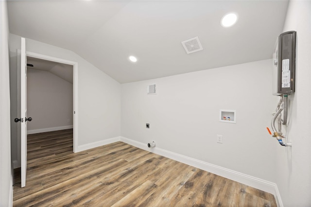 3806 Zephyr St, Houston, TX 77021 - washroom with visible vents, baseboards, hookup for a washing machine, and wood finished floors