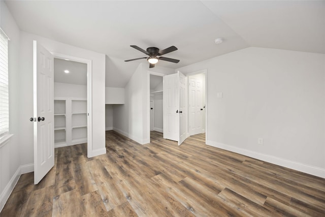 3806 Zephyr St, Houston, TX 77021 - unfurnished bedroom featuring baseboards, wood finished floors, and lofted ceiling