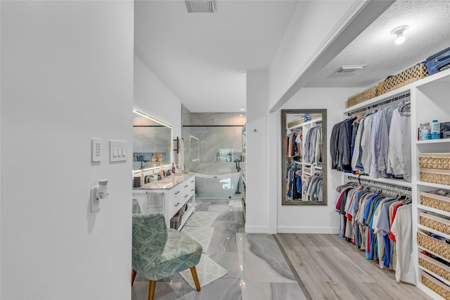 spacious closet featuring wood finished floors