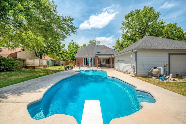 view of pool with a diving board, a fenced backyard, a fenced in pool, a patio, and a yard