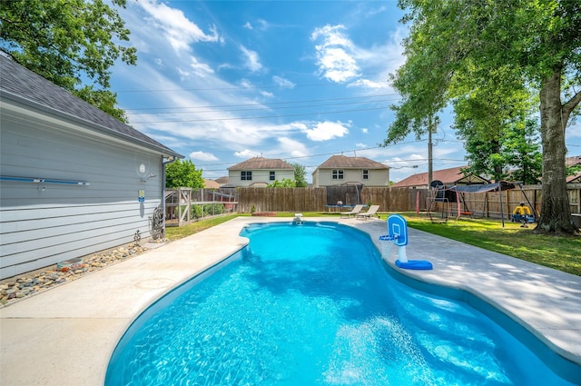 view of pool with a fenced backyard, a fenced in pool, a lawn, and a patio area