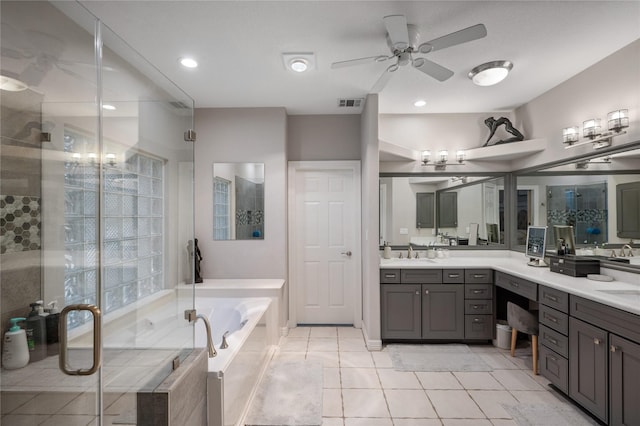 bathroom featuring ceiling fan, tile patterned floors, visible vents, a garden tub, and a stall shower