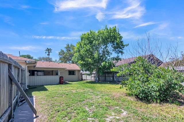 view of yard with a fenced backyard