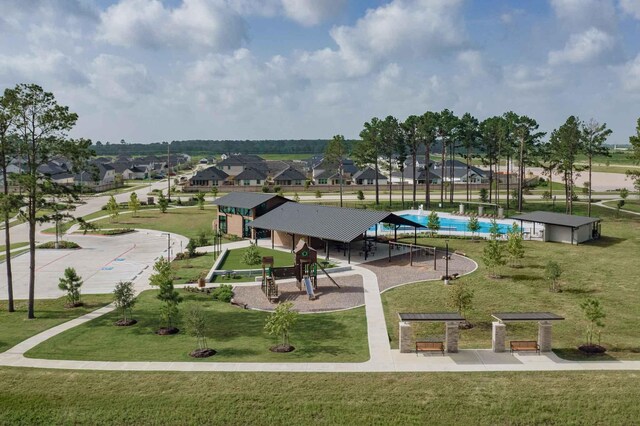 7602 Magnolia Orchid Ln, Cypress, TX 77433 - view of property's community featuring playground community, a residential view, and a lawn