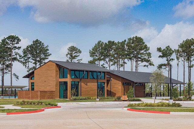 7602 Magnolia Orchid Ln, Cypress, TX 77433 - view of building exterior featuring fence and curved driveway
