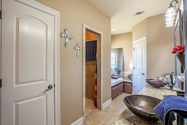 bathroom with a bath, tiled shower, visible vents, a sink, and tile patterned floors