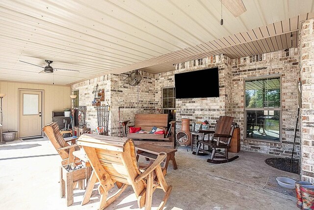view of patio / terrace featuring outdoor dining space and a ceiling fan