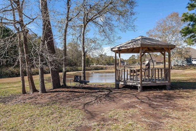 exterior space with a water view and a gazebo