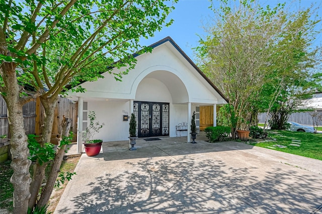 1265 Du Barry Ln, Houston, TX 77018 - view of exterior entry featuring french doors and stucco siding
