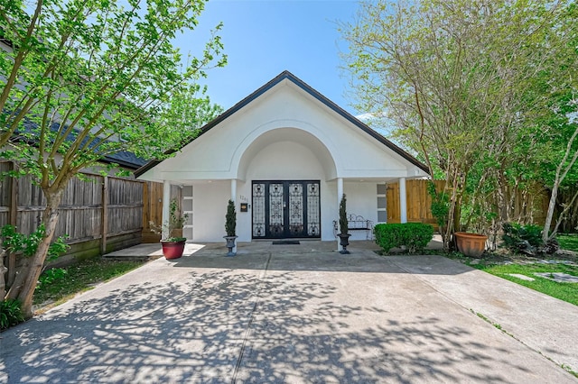 1265 Du Barry Ln, Houston, TX 77018 - view of front of property with a porch, stucco siding, and fence