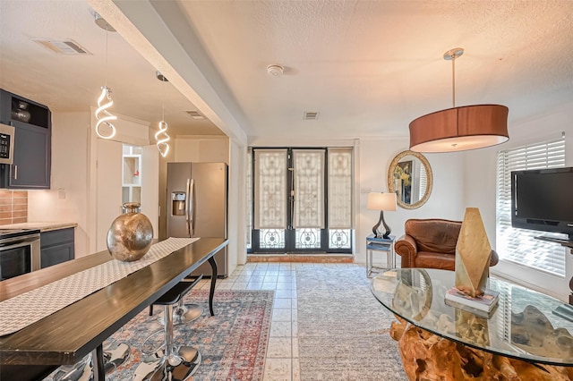 1265 Du Barry Ln, Houston, TX 77018 - living area with french doors, plenty of natural light, and visible vents