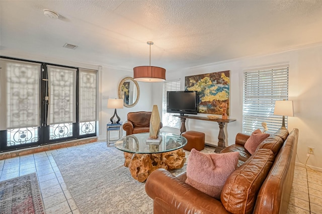 1265 Du Barry Ln, Houston, TX 77018 - living area featuring baseboards, tile patterned floors, french doors, a textured ceiling, and visible vents