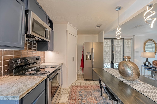1265 Du Barry Ln, Houston, TX 77018 - kitchen featuring visible vents, gray cabinets, light countertops, appliances with stainless steel finishes, and backsplash