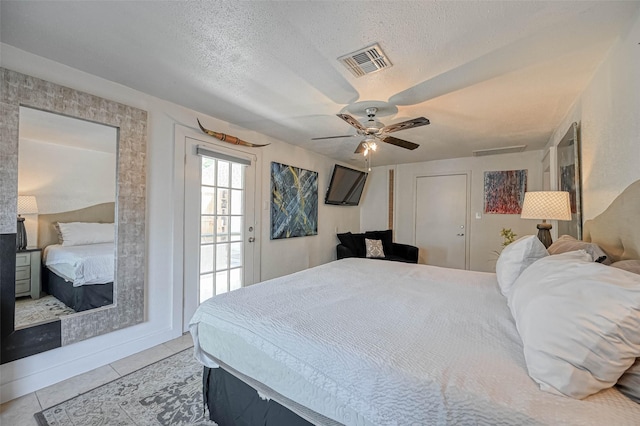 1265 Du Barry Ln, Houston, TX 77018 - tiled bedroom featuring visible vents, ceiling fan, and a textured ceiling