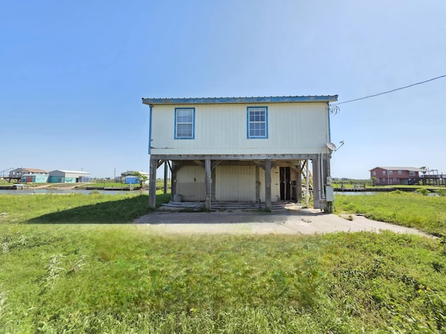900 Mariner St, Sargent, TX 77414 - exterior space featuring metal roof and a lawn