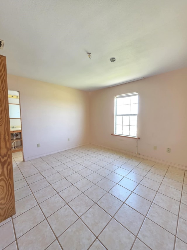 900 Mariner St, Sargent, TX 77414 - spare room with visible vents, baseboards, and light tile patterned flooring