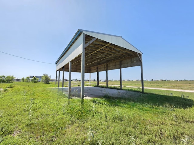 900 Mariner St, Sargent, TX 77414 - view of property's community with a detached carport, a rural view, and driveway