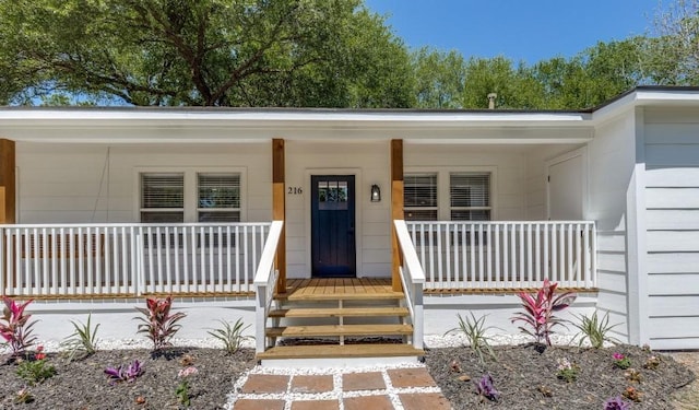 entrance to property with covered porch