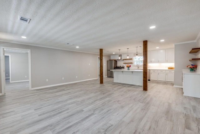 unfurnished living room with visible vents, recessed lighting, and a textured ceiling