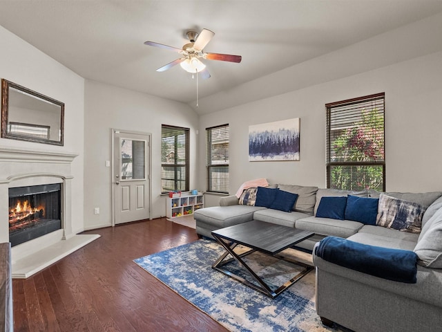 605 Pedernales St, Webster, TX 77598 - living room featuring ceiling fan, dark wood finished floors, and a fireplace