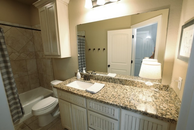 full bath featuring tile patterned floors, toilet, shower / bath combo with shower curtain, and vanity