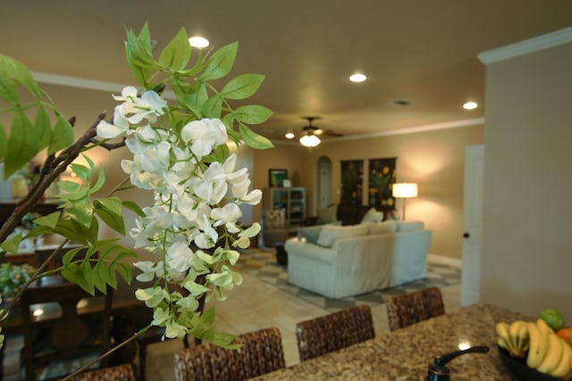 exterior space with recessed lighting, crown molding, and ceiling fan