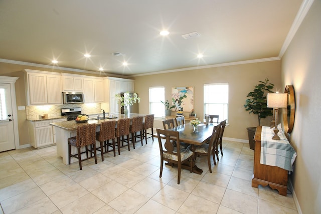dining area featuring ornamental molding, baseboards, recessed lighting, and light tile patterned flooring