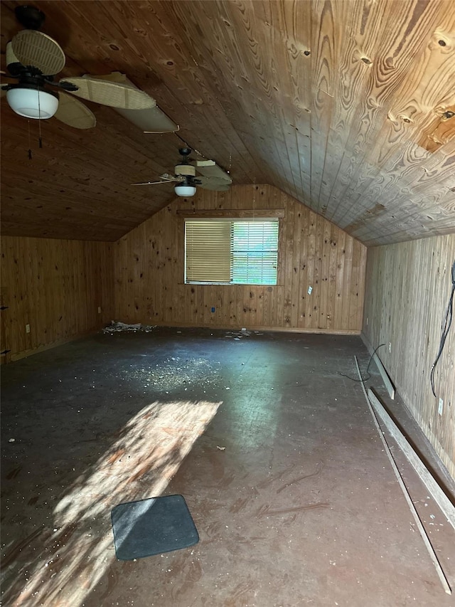 bonus room with wood walls, ceiling fan, wooden ceiling, and lofted ceiling