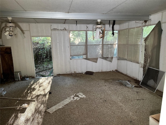 interior space featuring ceiling fan