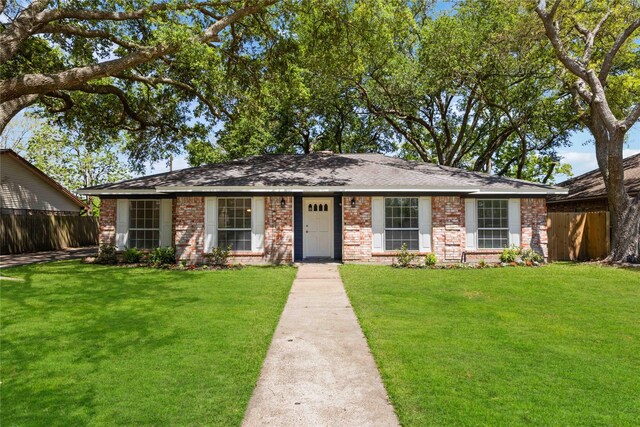 12418 A Bar Dr, Santa Fe, TX 77510 - view of front of property featuring brick siding and a shingled roof