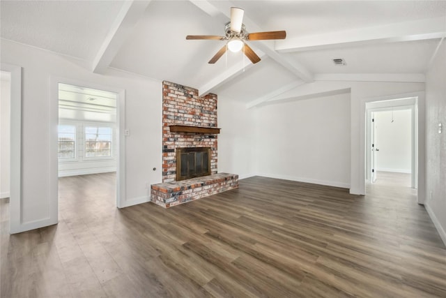 12418 A Bar Dr, Santa Fe, TX 77510 - unfurnished living room featuring ceiling fan, wood finished floors, a brick fireplace, and baseboards