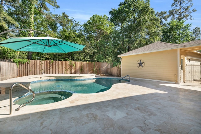 view of pool featuring an in-ground hot tub, a fenced backyard, and a patio area