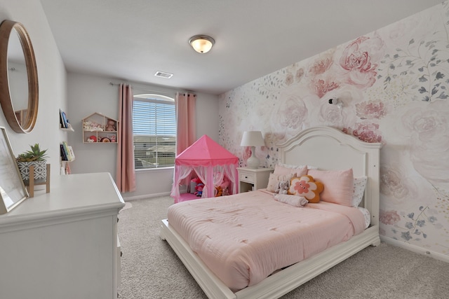 bedroom with baseboards, light colored carpet, and wallpapered walls