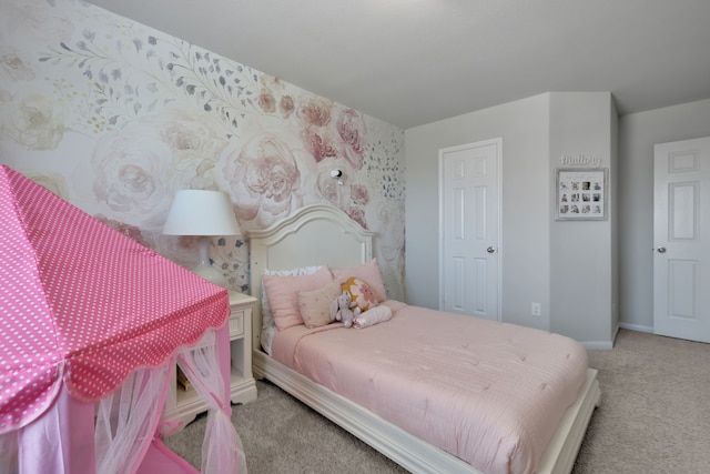 carpeted bedroom featuring baseboards